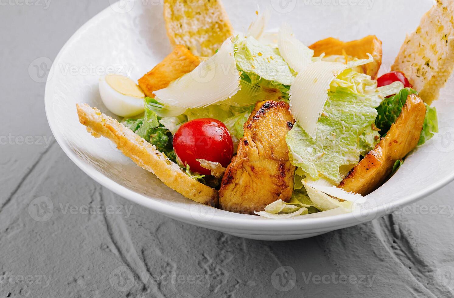 Fresh caesar salad with grilled chicken photo