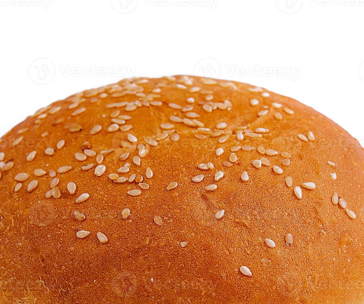 Fresh sesame seed burger bun isolated on white photo