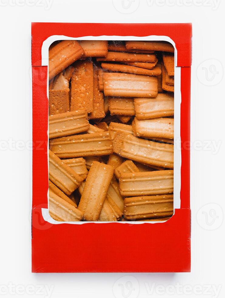 Box of breadsticks isolated on white background photo