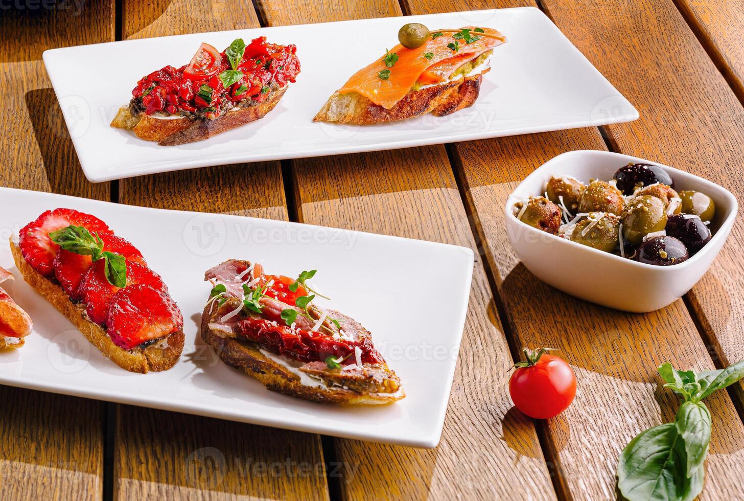 Gourmet bruschetta assortment on wooden table photo