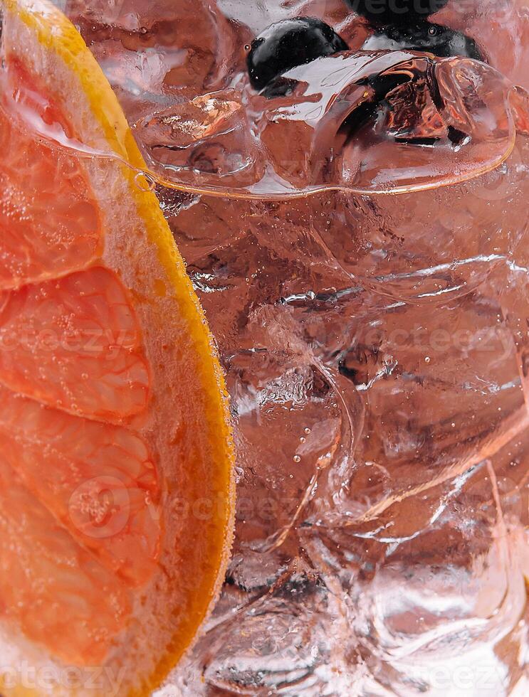 Close-up of iced drink with grapefruit slice photo
