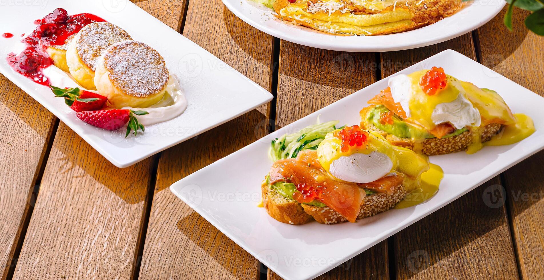 Gourmet brunch spread on wooden table photo