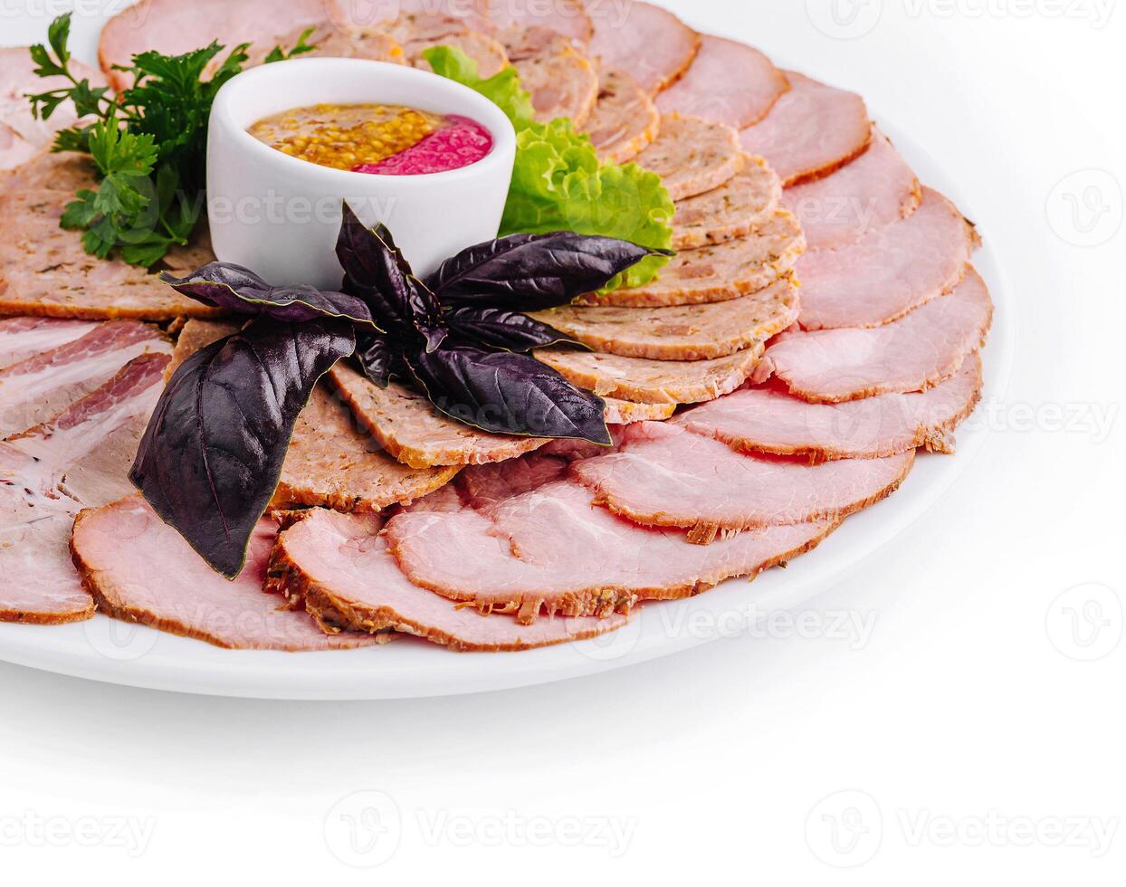 Sliced roast pork platter with mustard sauce photo