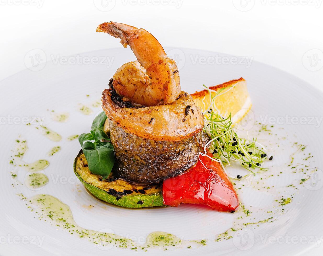 Gourmet shrimp and vegetable entree photo