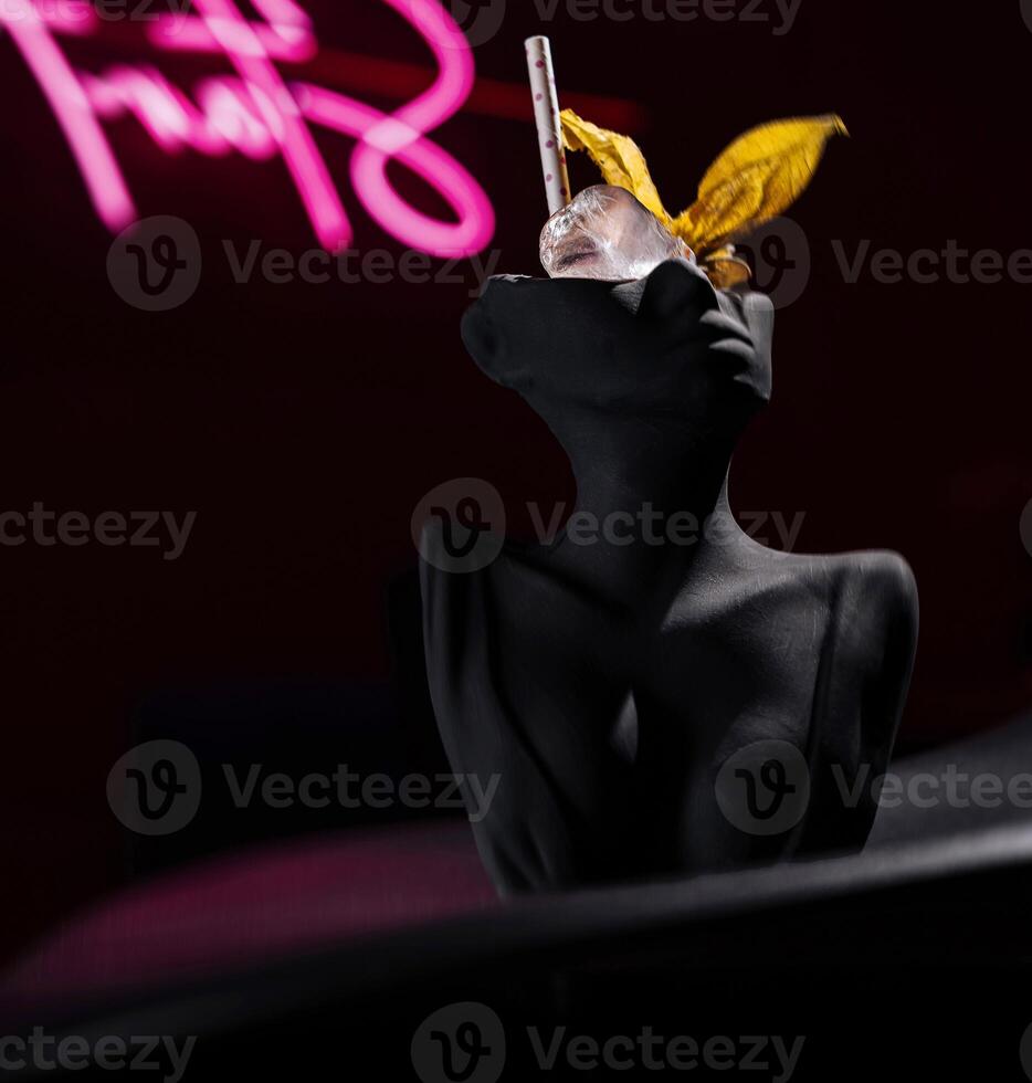 Elegant statue with neon sign photo