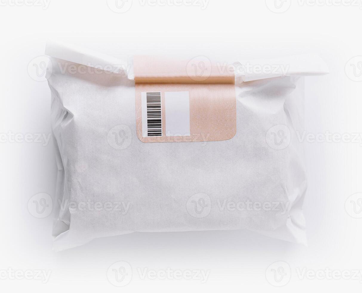 Wrapped product with barcode isolated on white photo