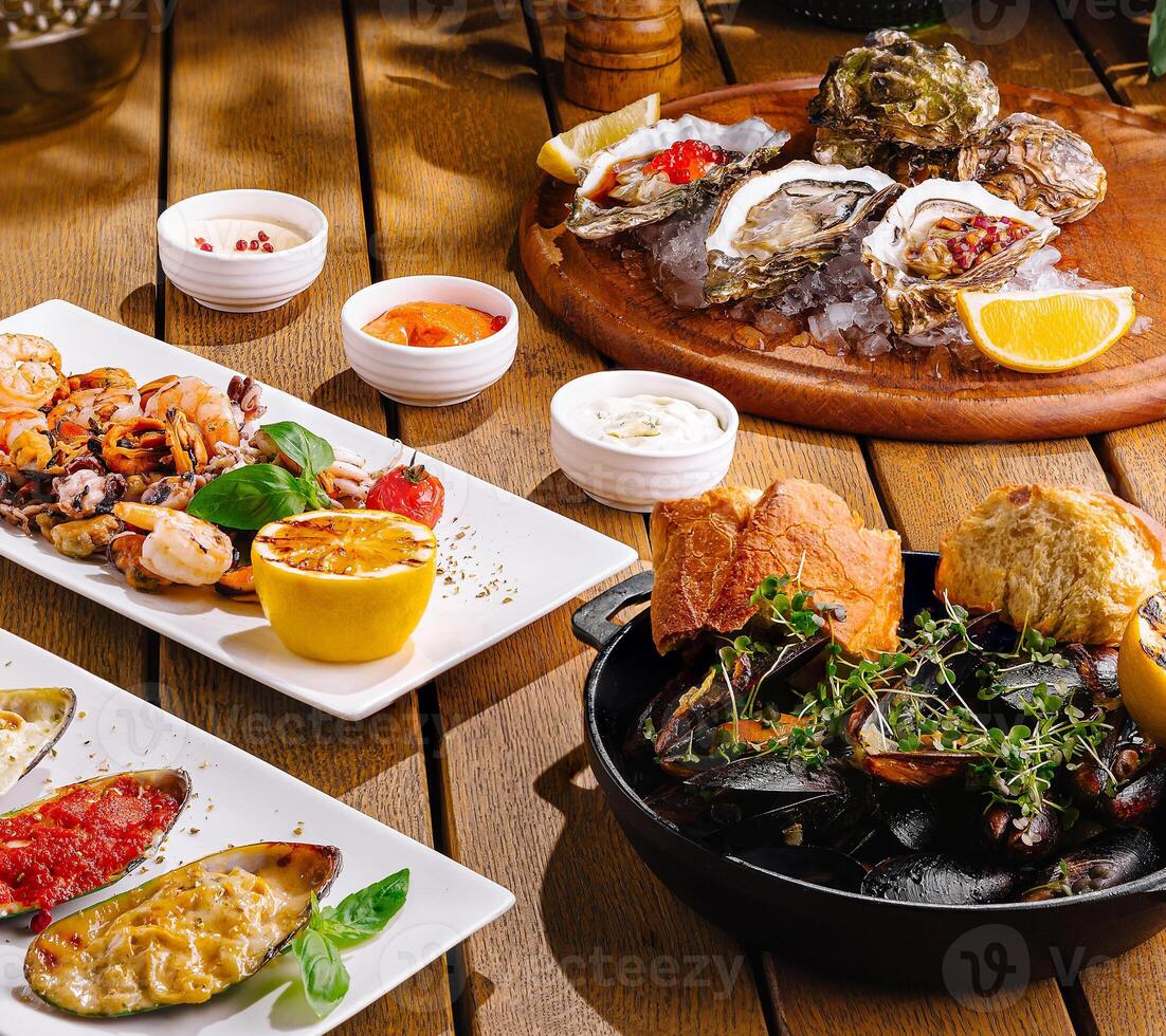 Gourmet mediterranean feast on rustic wooden table photo