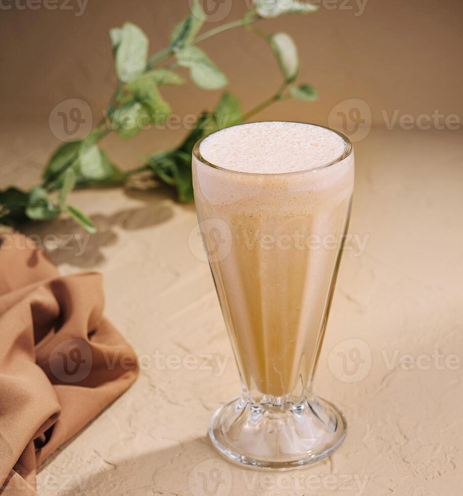 Refreshing milkshake in elegant glass photo