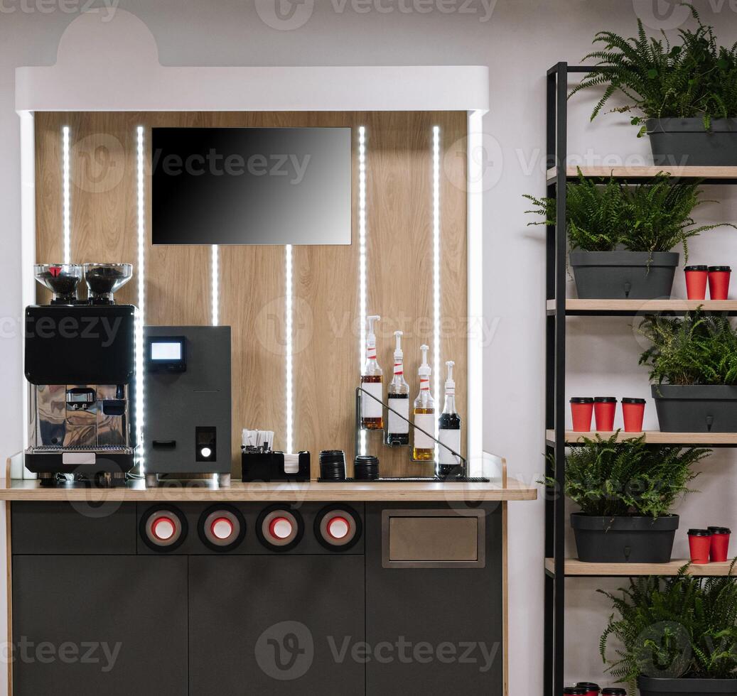 Modern office coffee station with plants photo