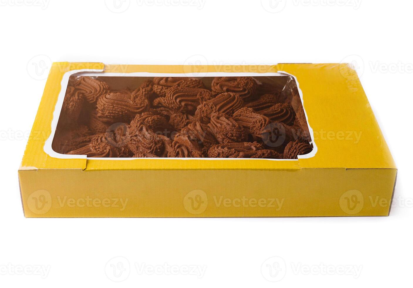 Box of chocolate spritz cookies is lying on a white background photo
