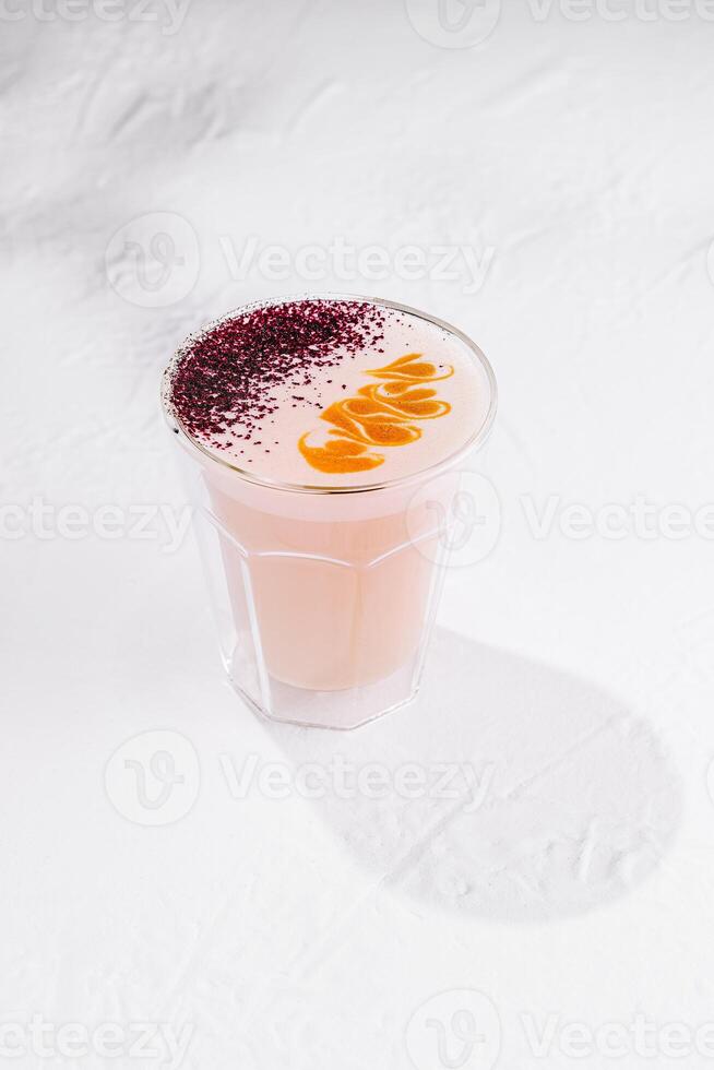 Pink moon milk beverage standing on white background casting shadow photo
