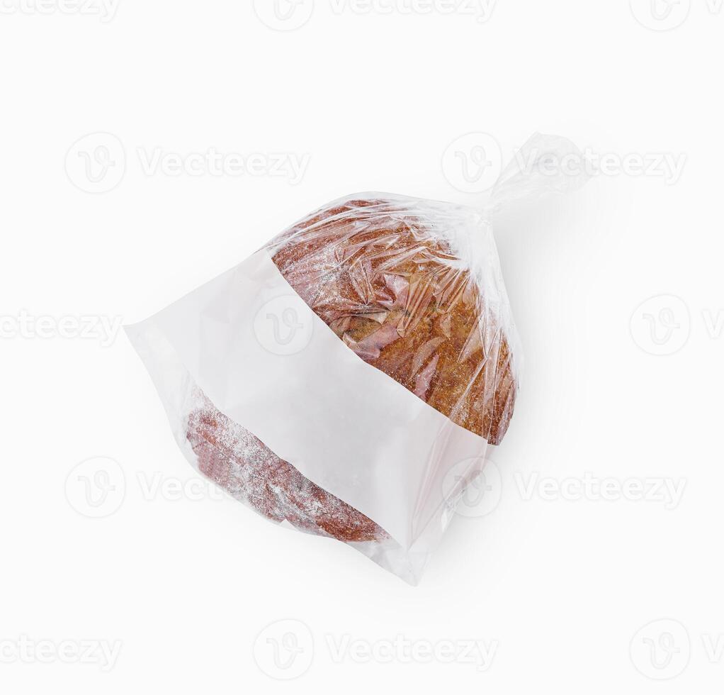 Freshly baked loaf of bread in a plastic bag with a blank label for branding photo