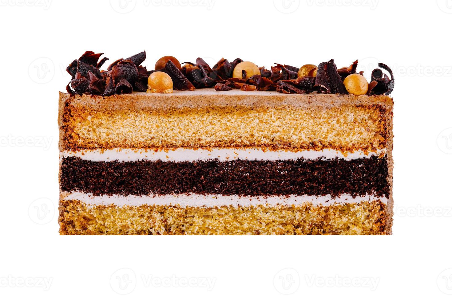 Delicious layered cake with chocolate curls and icing on white background photo