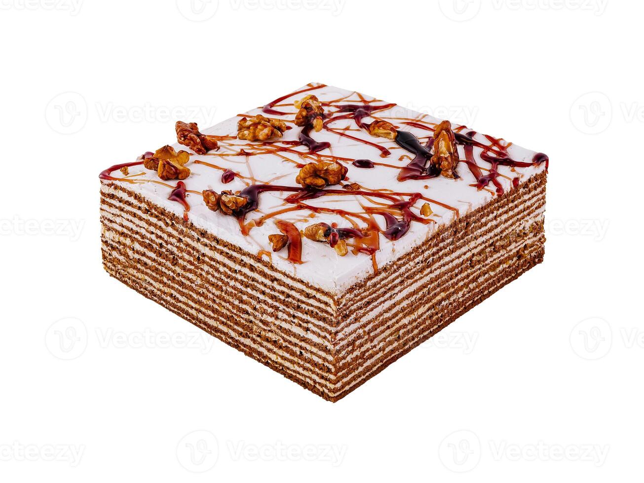 Delicious square honey cake standing on white background photo