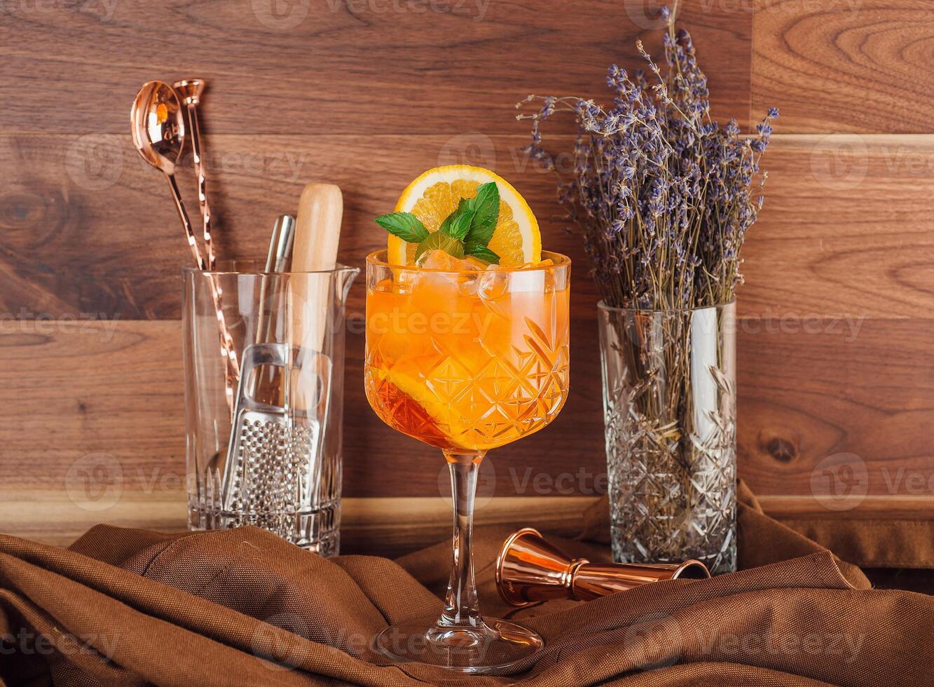 Aperol spritz cocktail is standing on the bar counter and waiting bartender photo