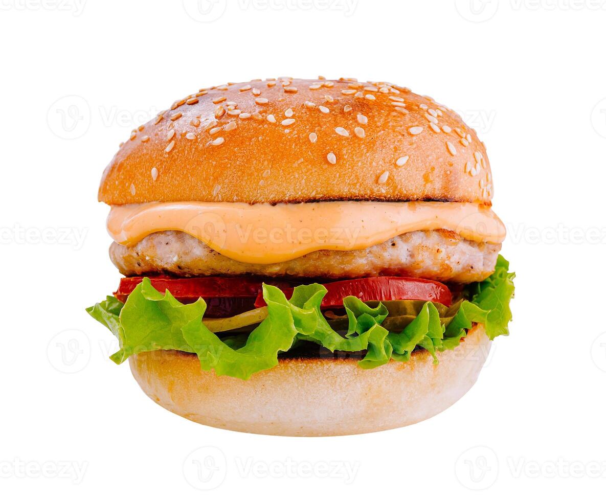 Delicious burger with chicken patty, vegetables and sauce on white background photo