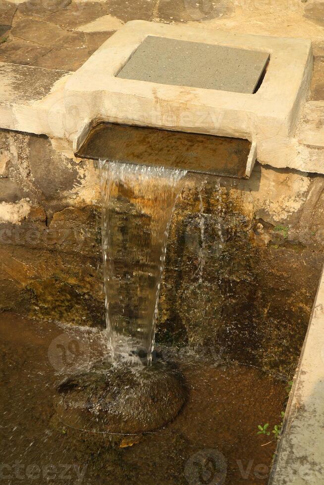 Waterfall fountain of the pond photo