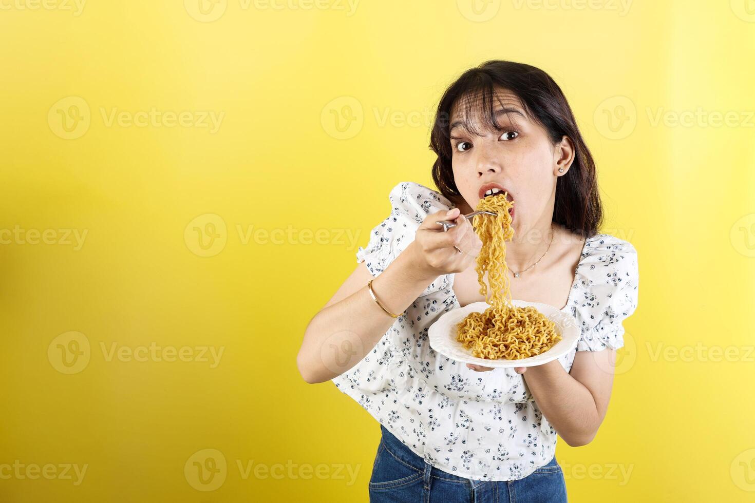 Happy Asian Woman Eating Instant Noodles photo