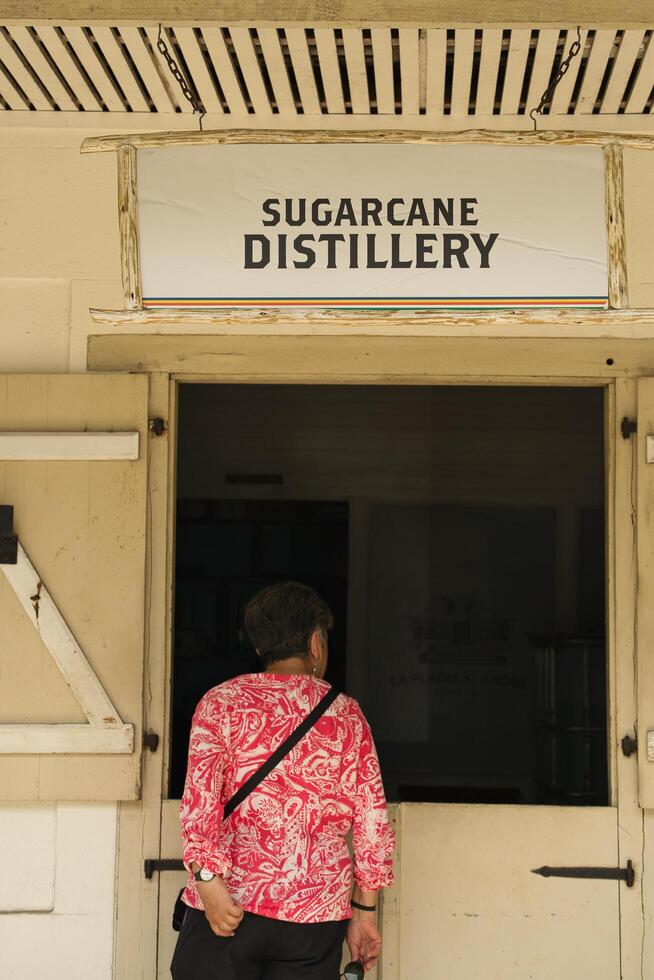 Mahe, Seychelles 21.08.2024 Single middle age looking inside the sugar cane rum distillery at the takamaka rum distillery photo