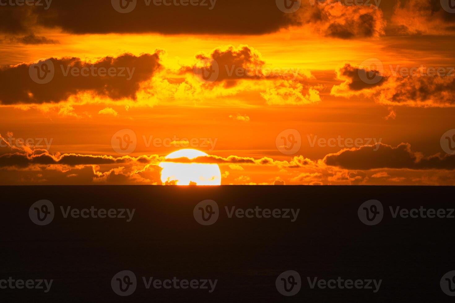 Beautiful golden sunset over the ocean, Mahe Seychelles photo