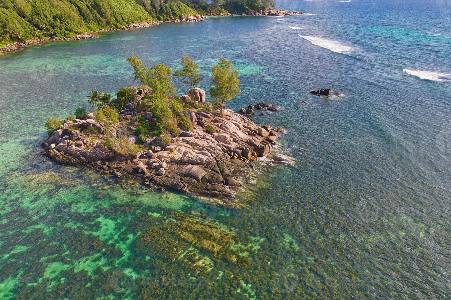 Drone arial shot of Anse royale, fairy land small island, mice island, with granite stones and turquoise water, Mahe Seychelles photo