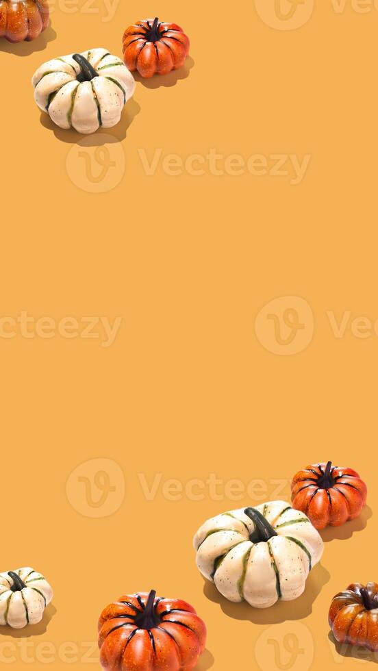 Pumpkin pattern creative on orange yellow background vertical banner minimal copy space photo