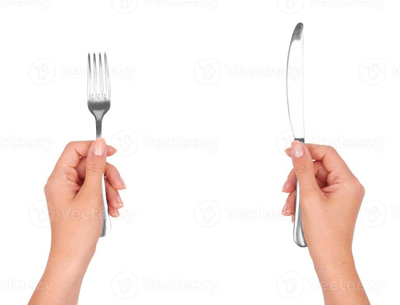 A knife and fork in hands photo