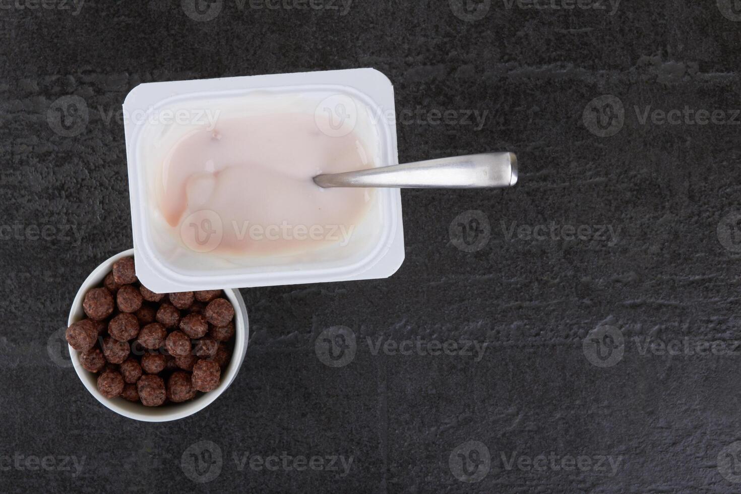 Fruit yogurt on stone photo