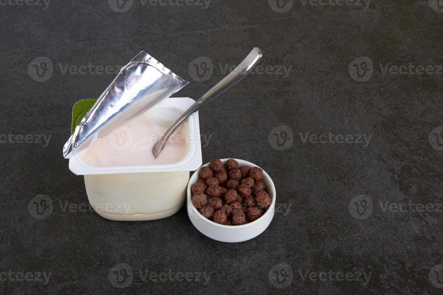 Fruit yogurt on stone photo