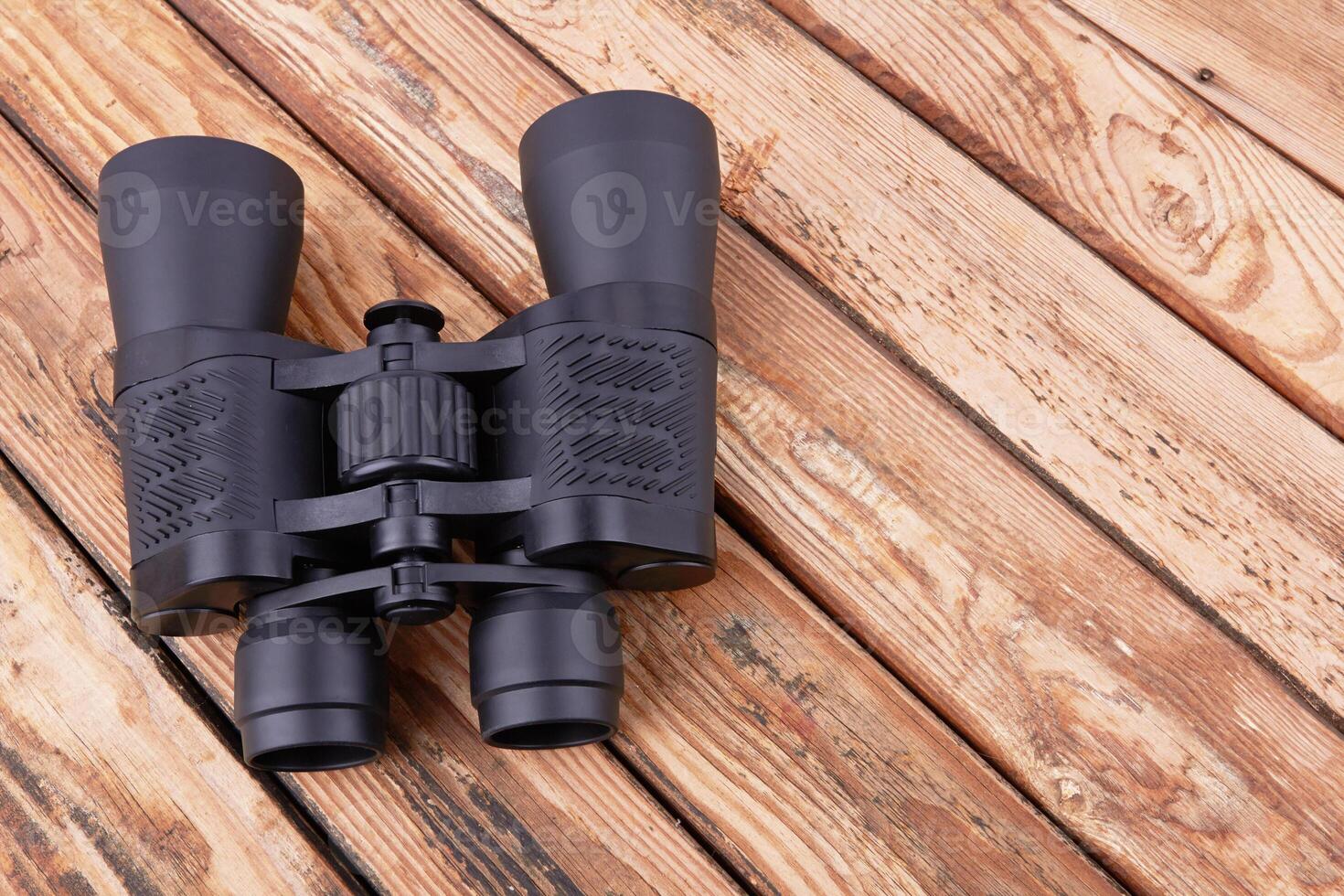 Binoculars on wood photo