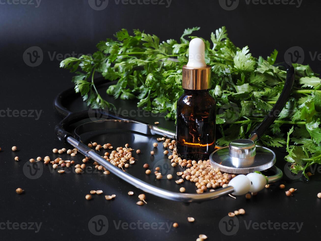 Cold-pressed coriander oil has properties in helping the digestive system, as a facial lotion, as a massage for relaxing muscles after exercise. Healthy concept. photo