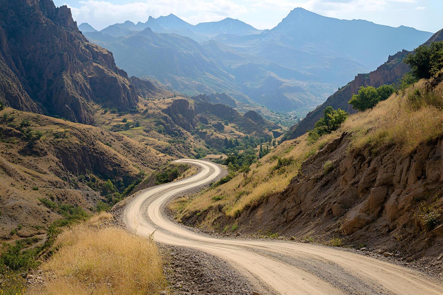 Twisting Mountain Road with Sharp Hairpin Curves and Breathtaking Valley Views, Framed by a Clean White Background photo