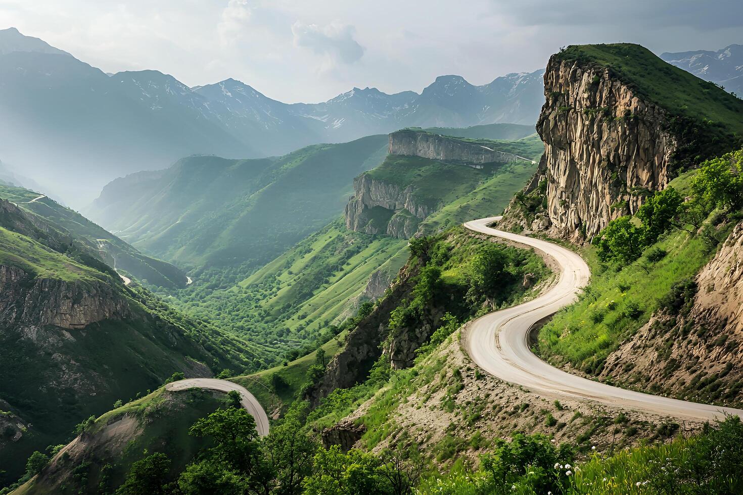 Twisting Mountain Road with Sharp Hairpin Curves and Breathtaking Valley Views, Framed by a Clean White Background photo
