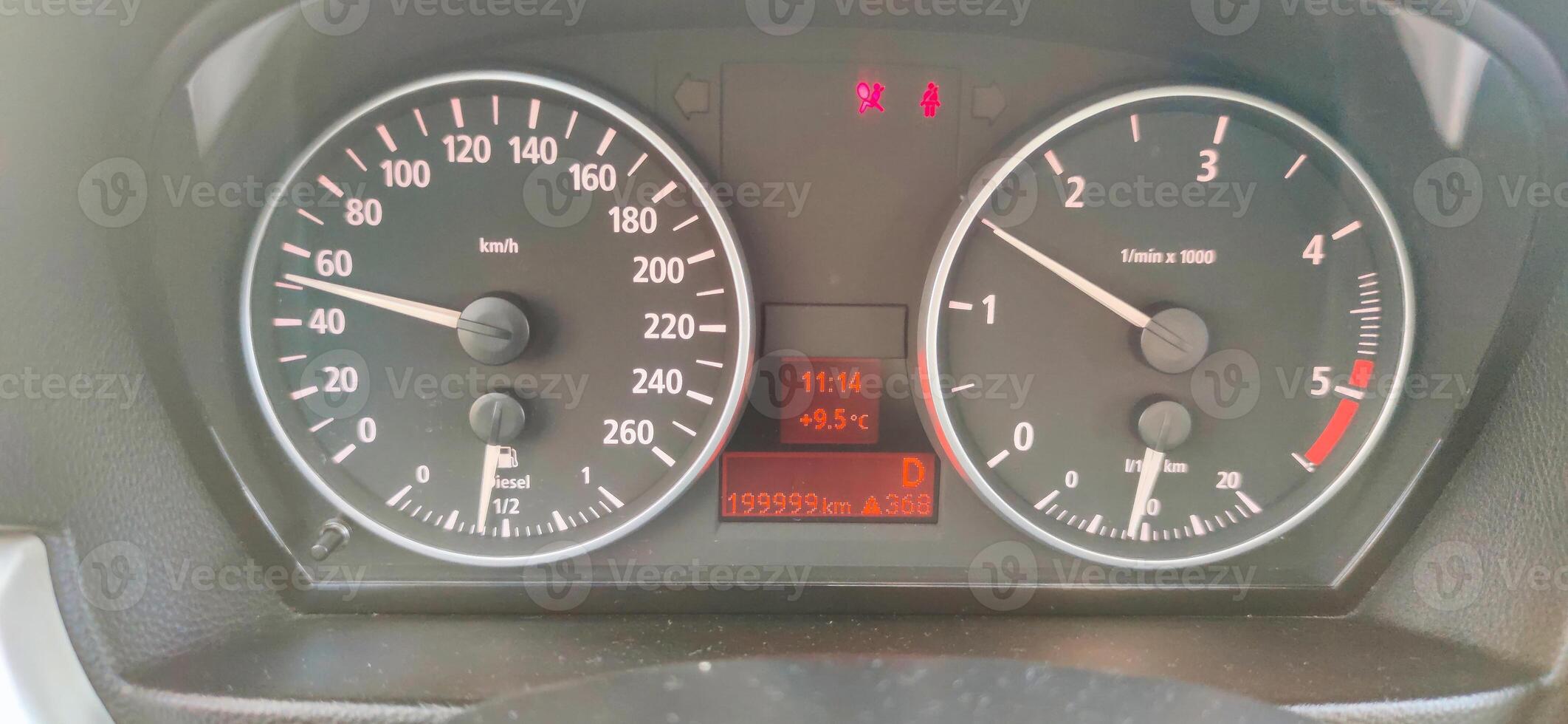Car dashboard showing almost 200,000 kilometers driven photo