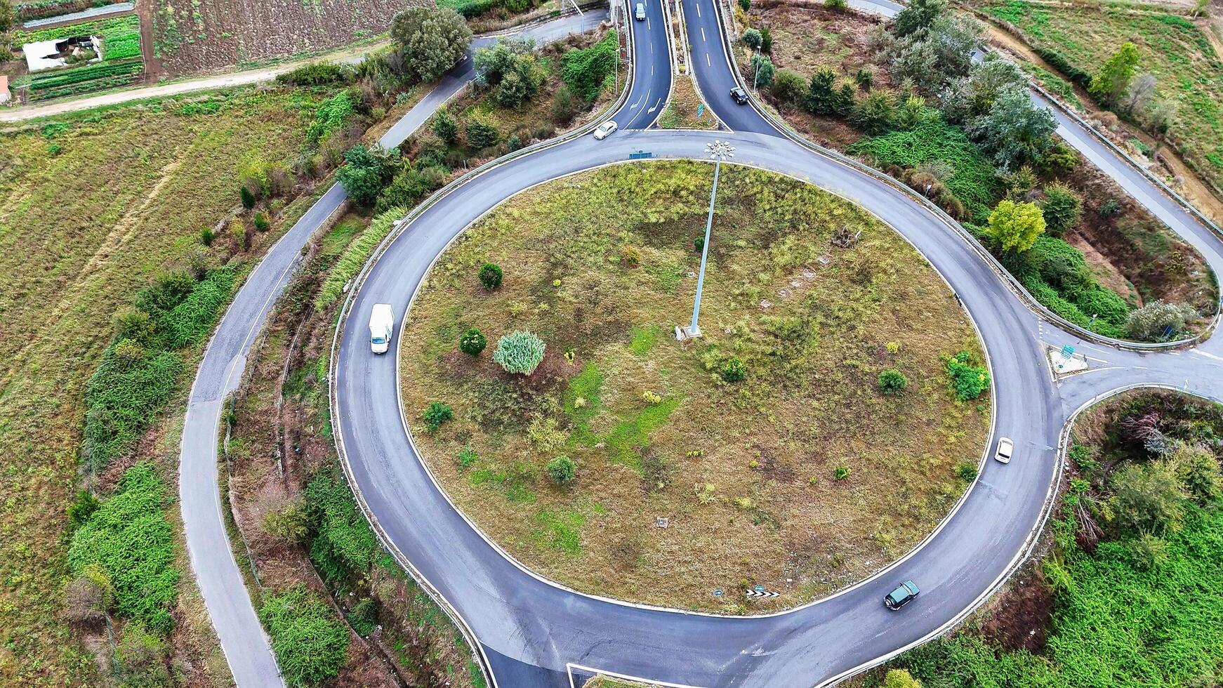 Aerial view of cars driving in a circle in city traffic. High quality 4k footage photo