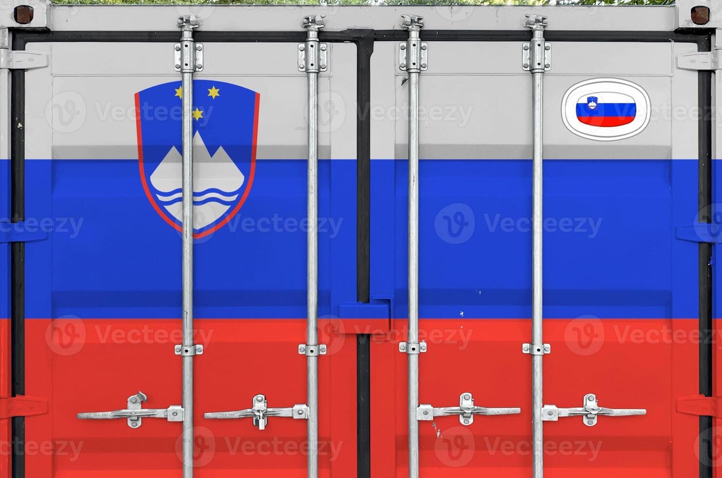 Slovenia flag depicted on metal doors of shipping cargo container outdoors in docks area photo