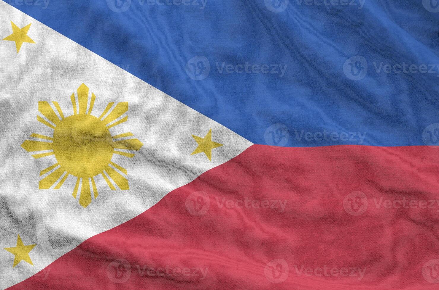 Philippines flag depicted on folded wavy fabric of old cloth photo
