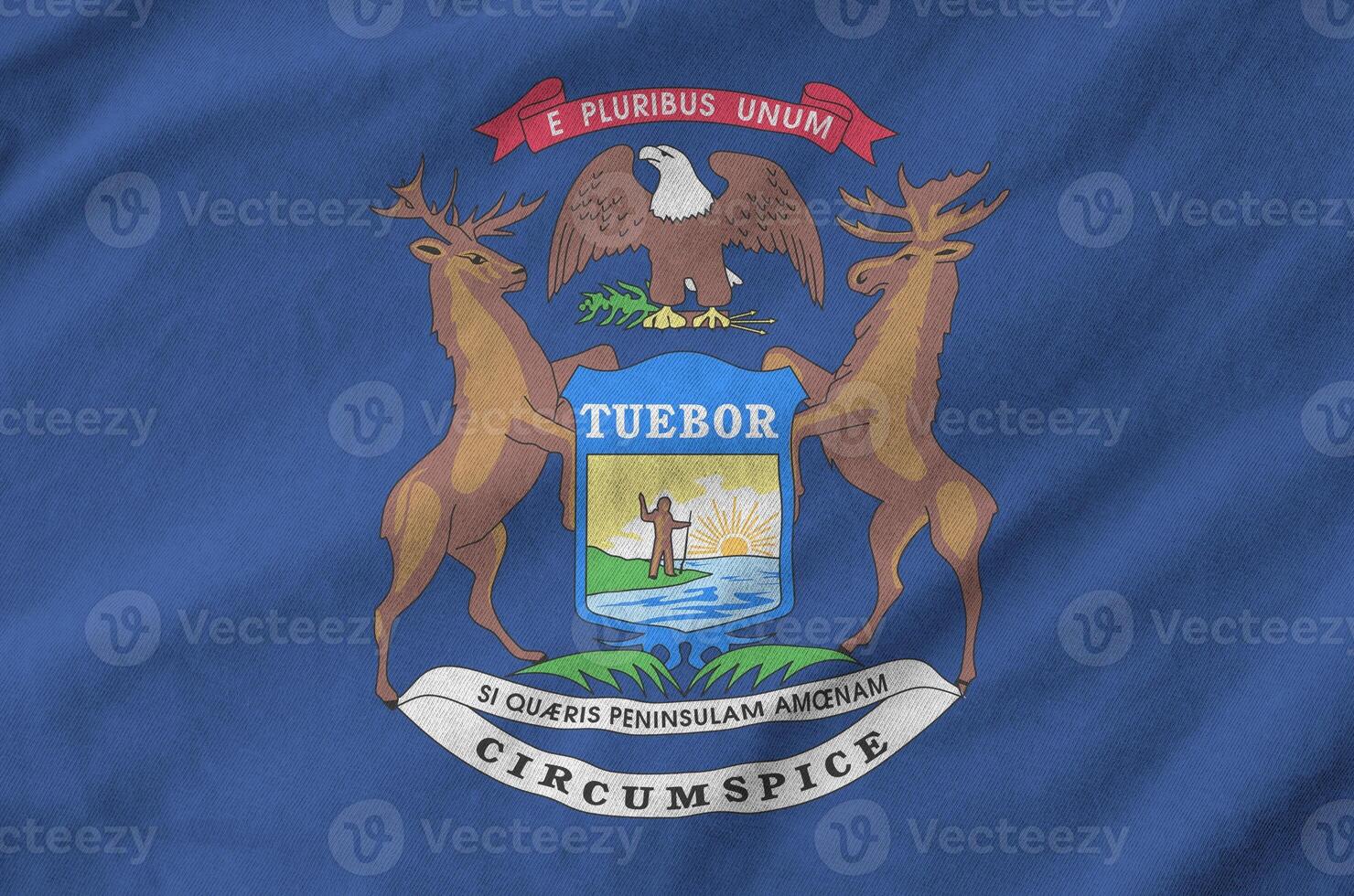Michigan US state flag depicted on folded wavy fabric of old cloth photo