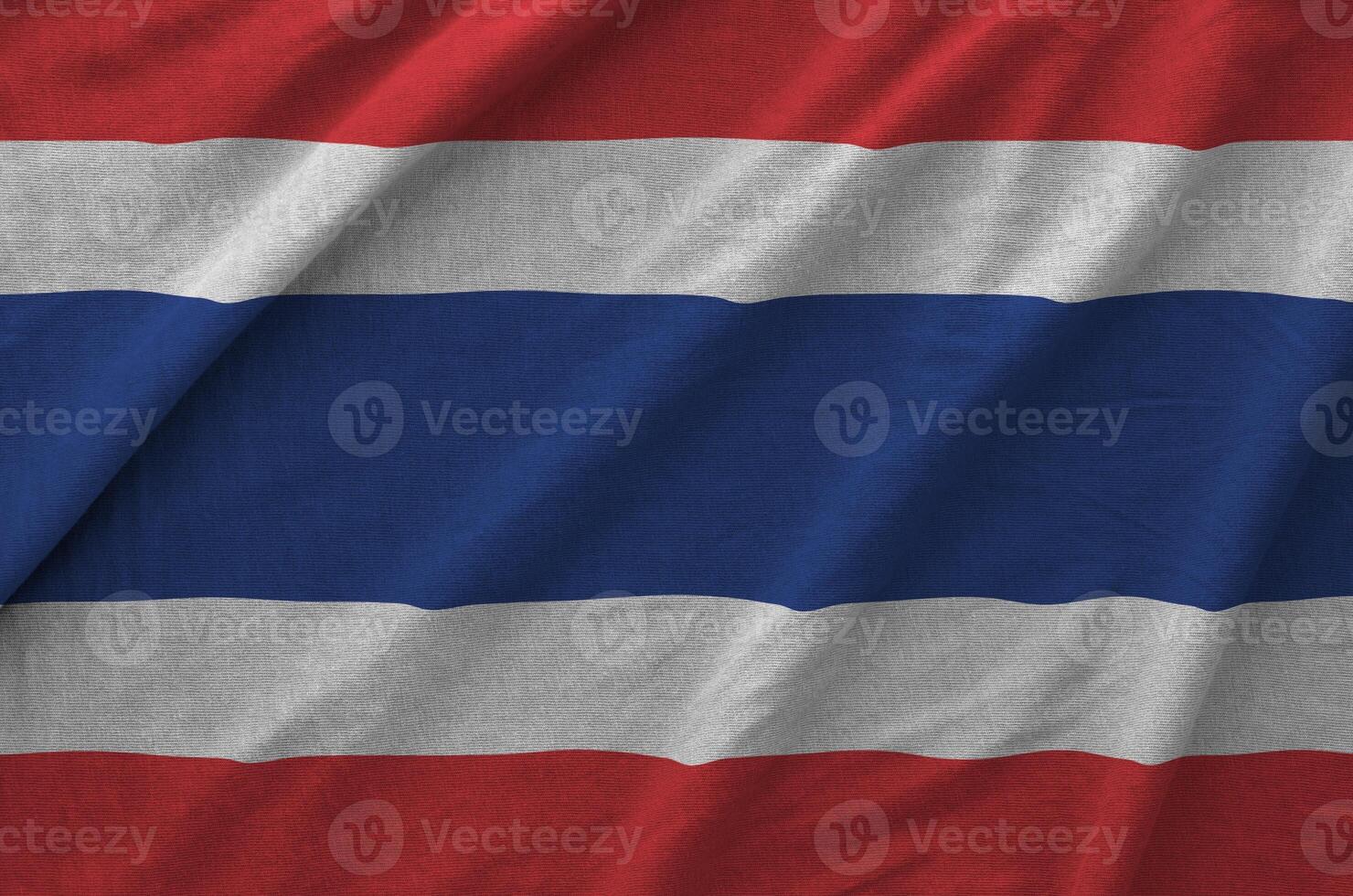 Thailand flag depicted on folded wavy fabric of old cloth photo