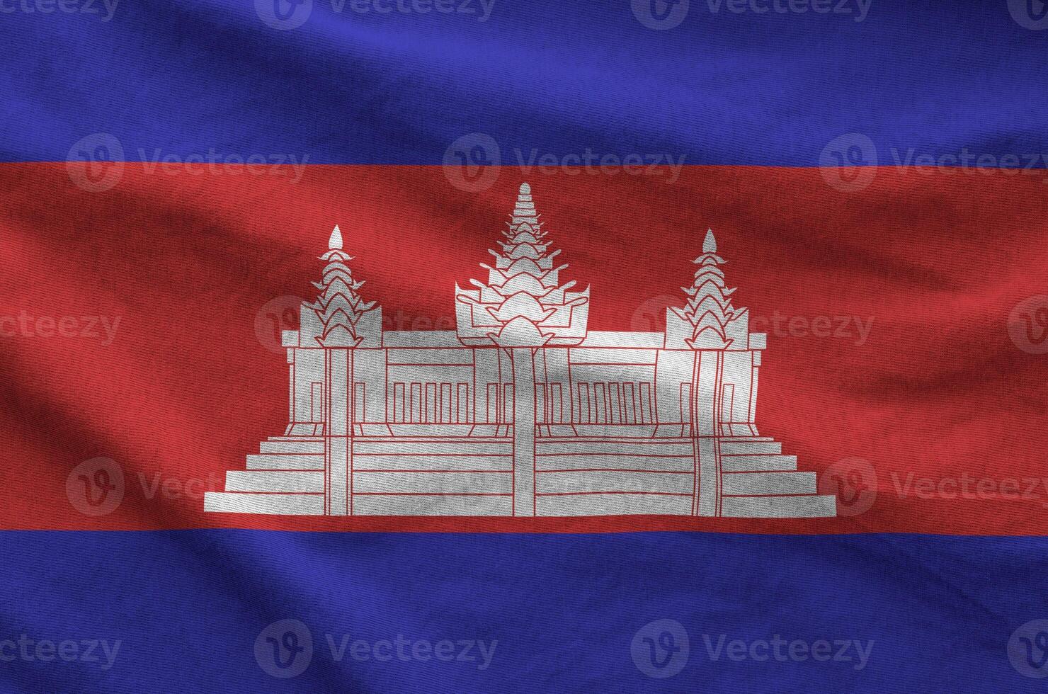 Cambodia flag depicted on folded wavy fabric of old cloth photo