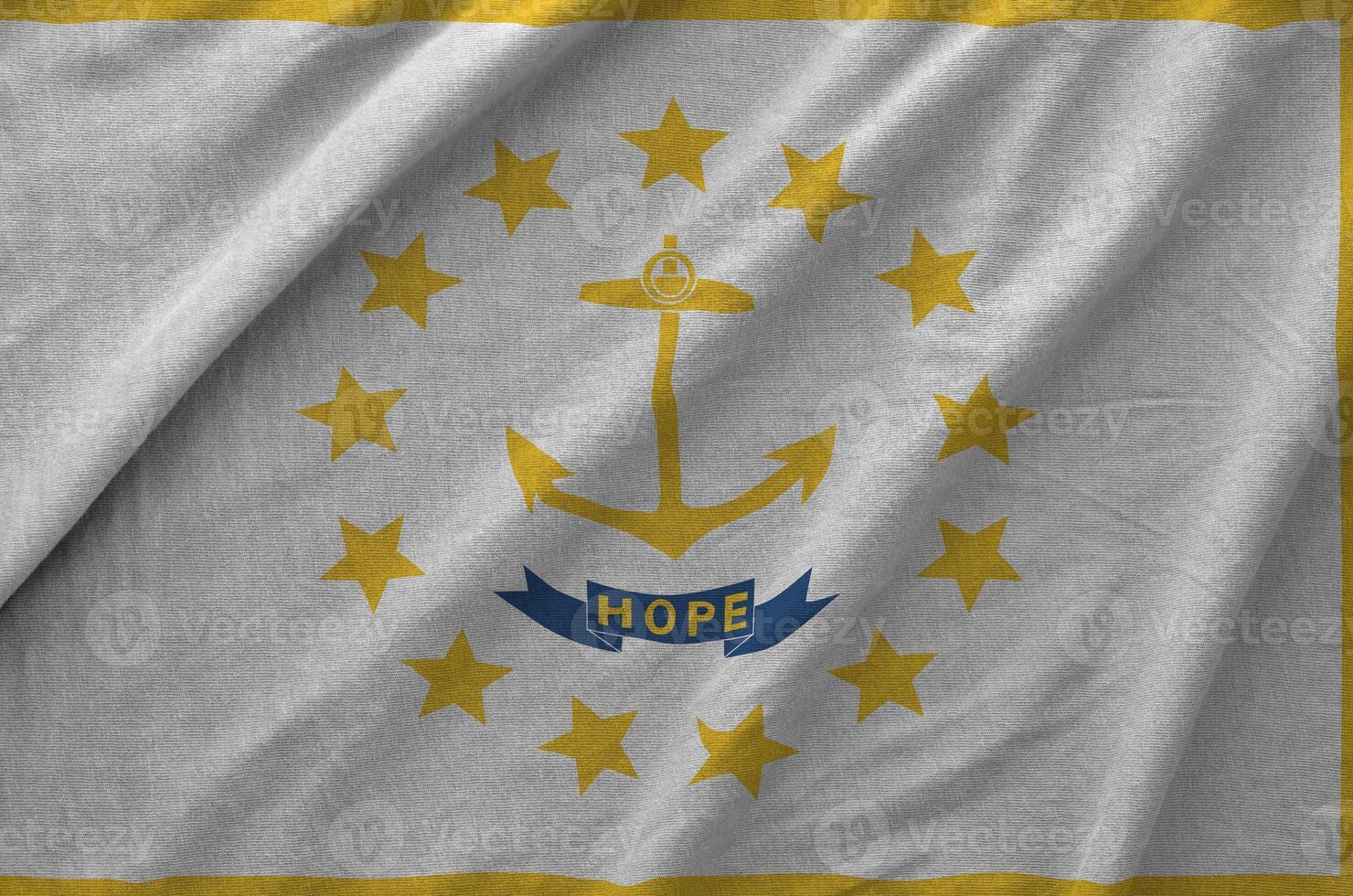 Rhode Island US state flag depicted on folded wavy fabric of old cloth photo