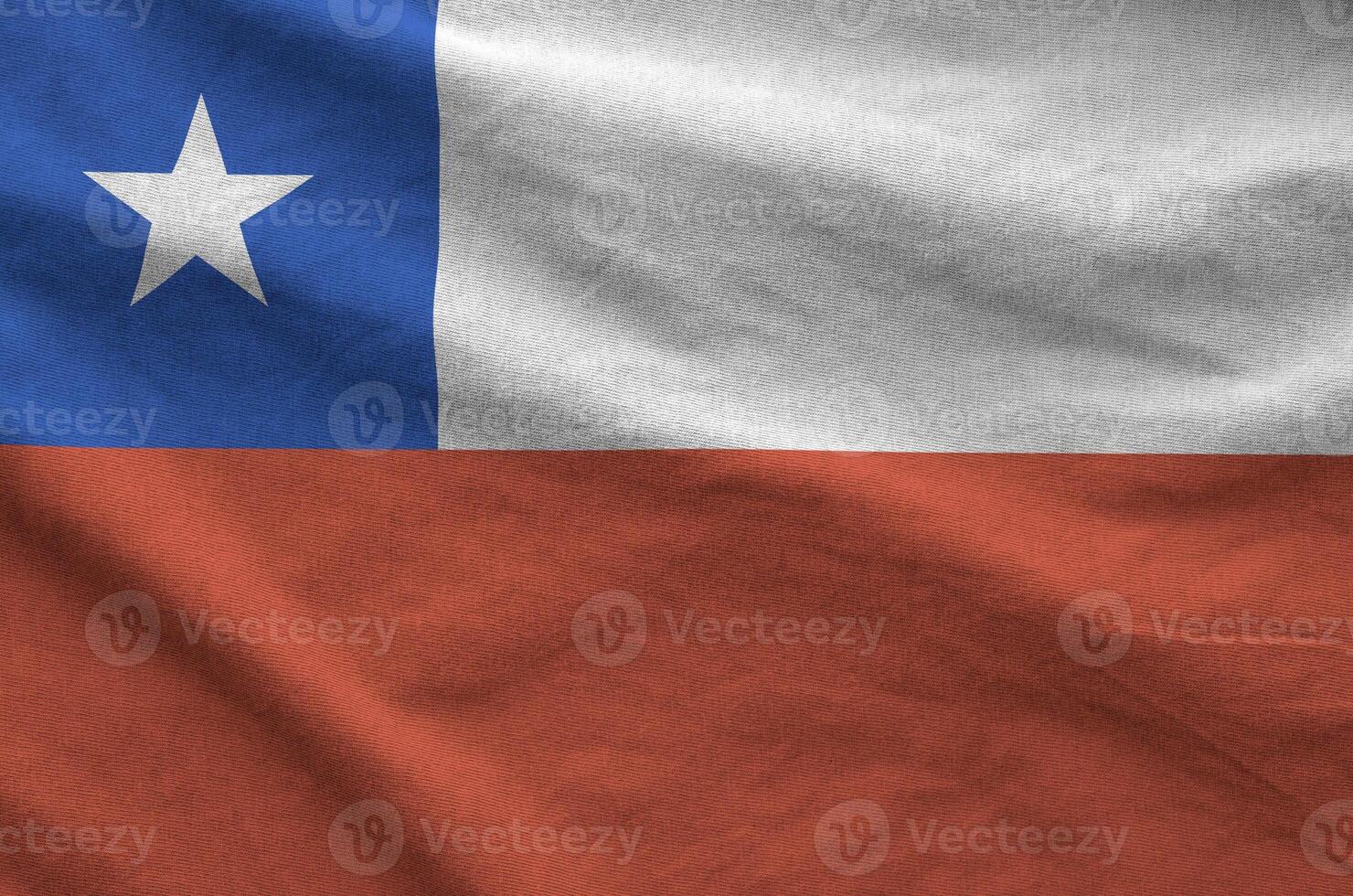 Chile flag depicted on folded wavy fabric of old cloth photo