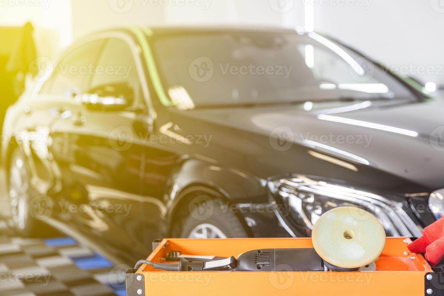 Detail to equipment for car detailing, polisher, cloths and wax for removing scratches from the car, car detailing concept photo
