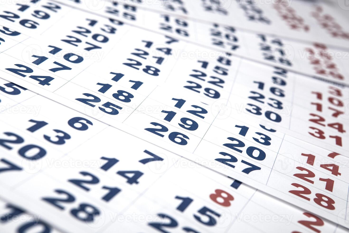 sheets of wall calendar with the number of days photo