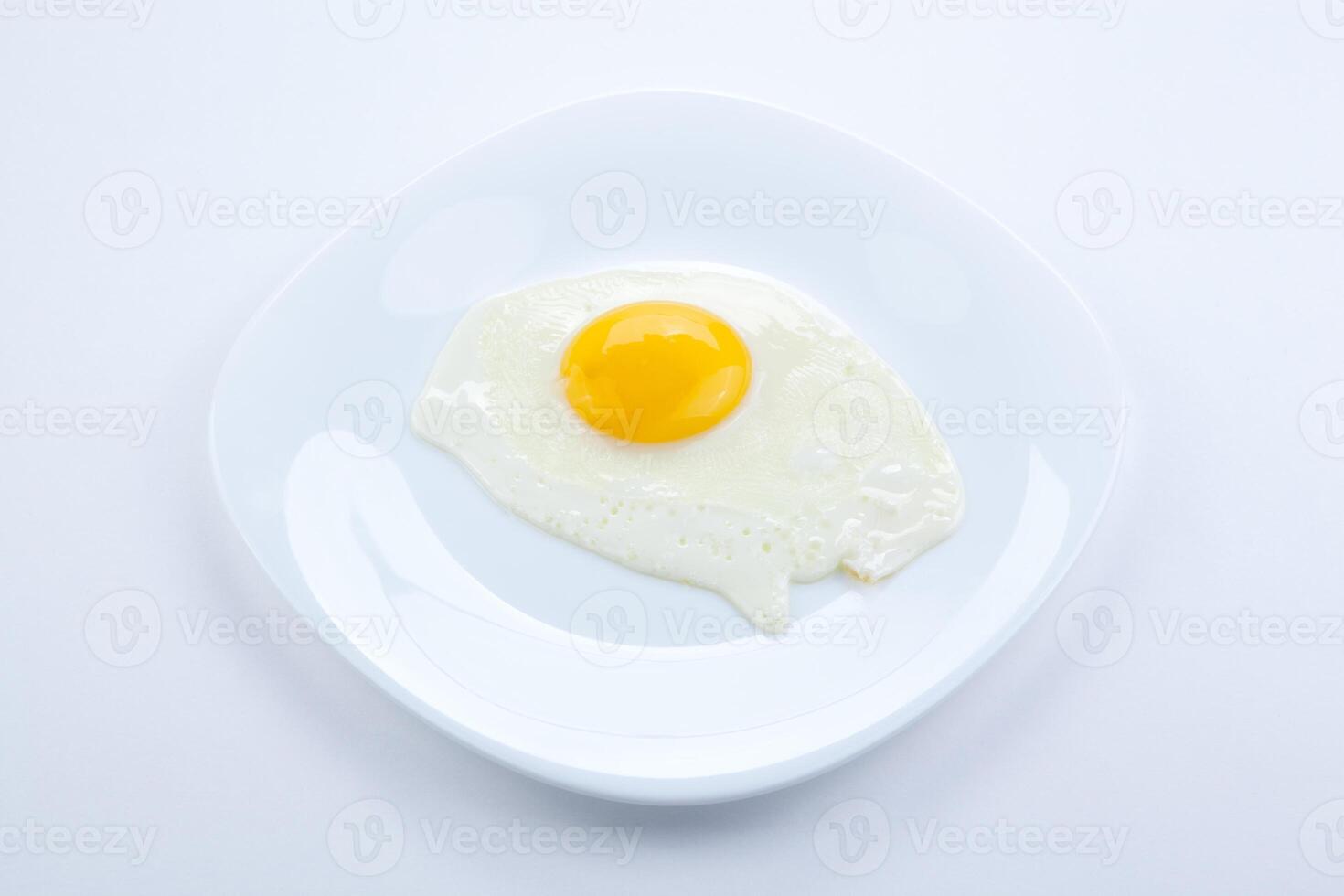 white plate with scrambled eggs photo