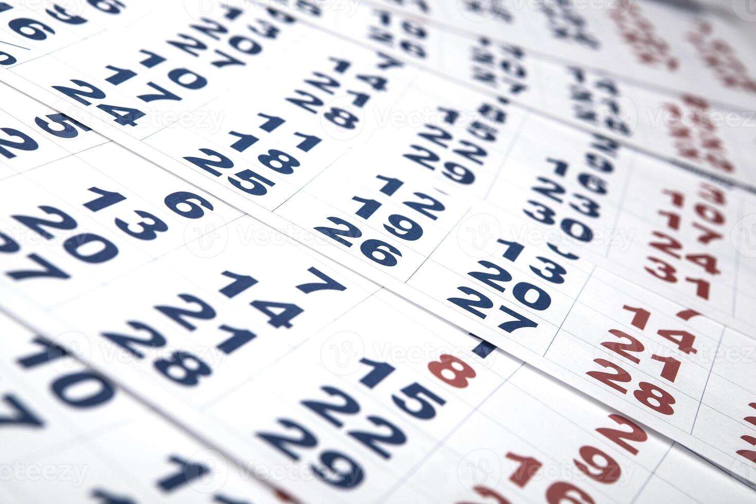 sheets of wall calendar with the number of days photo