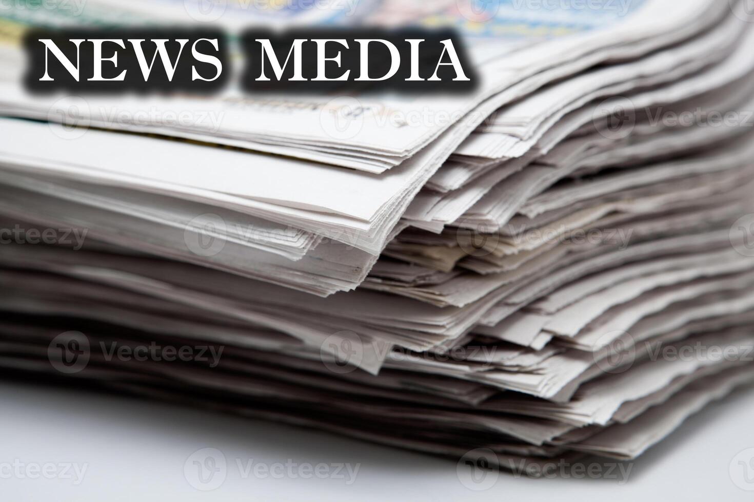 stack of newspapers on a white background photo