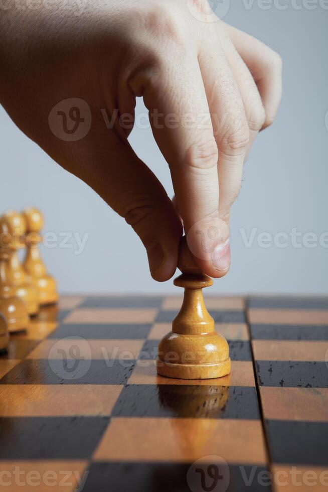 man makes a move chess pawn photo