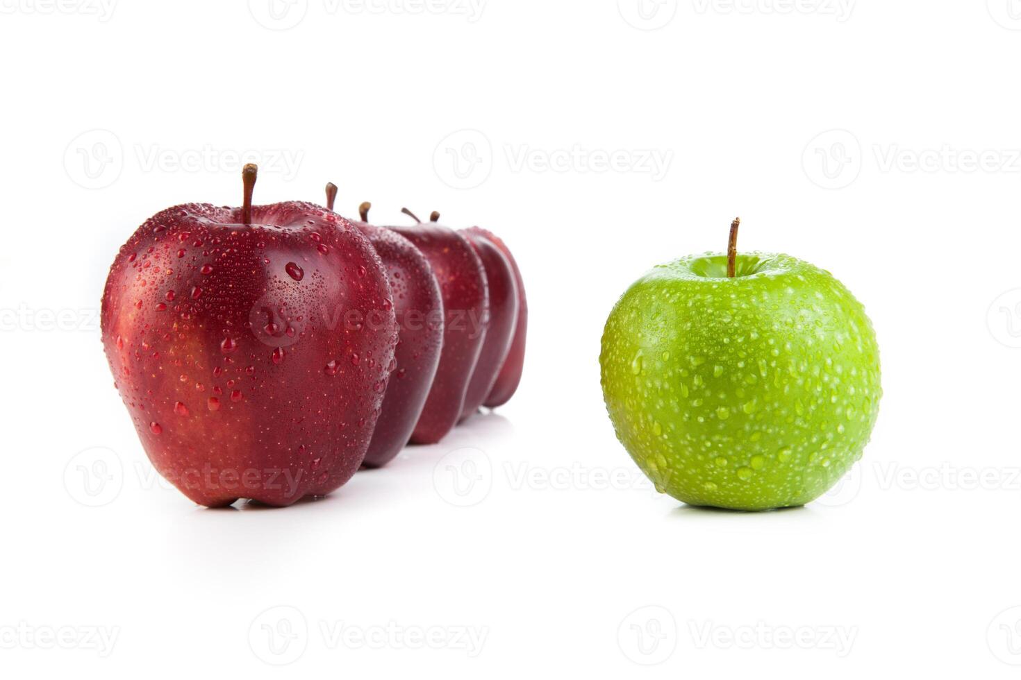 maroon apples lined up in a row and green apple closeup photo