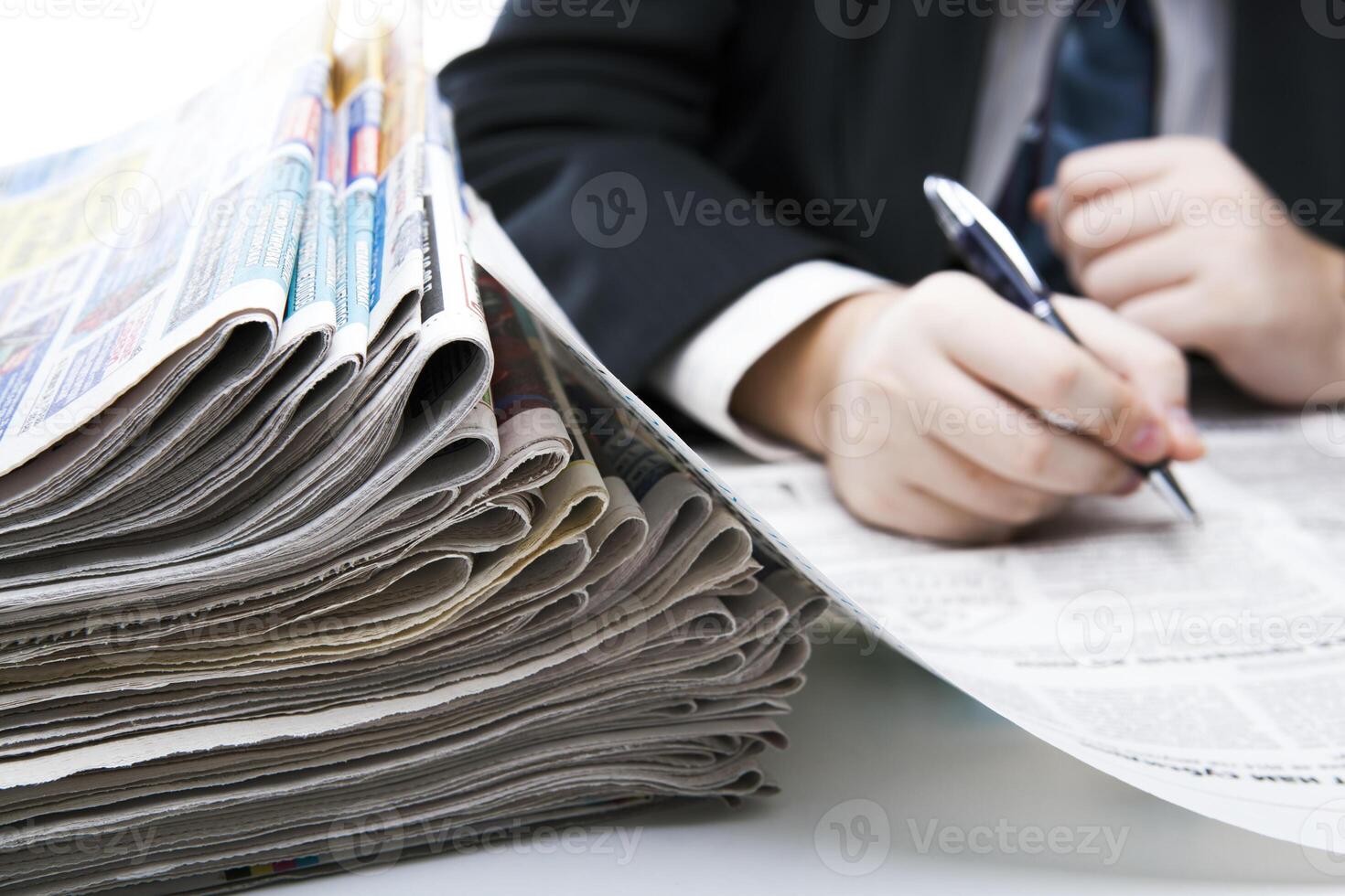 stack of newspapers in office close-up photo